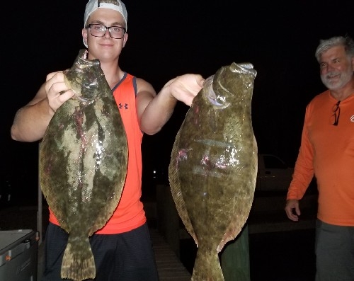 1 YOUNG GUY 2 GIANT FLOUNDER