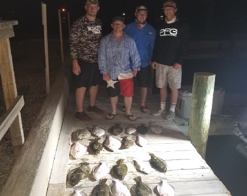 4 GUYS AT DOCK WITH FLOUNDER