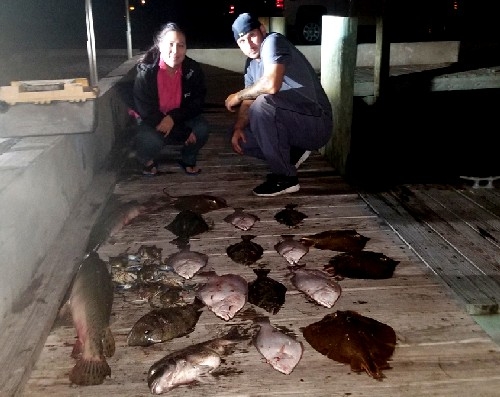 COUPLE WITH FISH AND FLOUNDER