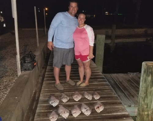 COUPLE WITH FLOUNDER