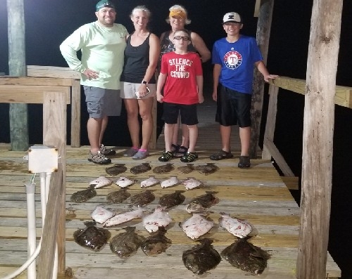 FAMILY WITH PRETTY GIRL FLOUNDER CATCH