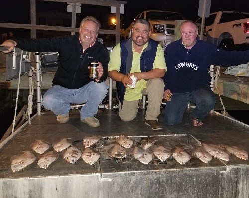 HAPPY GUYS WITH FLOUNDER
